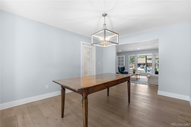 6795 E Kettle Ave, Centennial, CO 80112 - dining room with a chandelier and light wood-type flooring