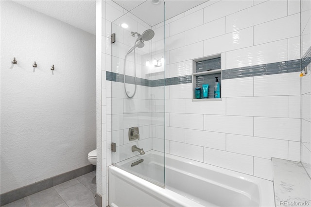6795 E Kettle Ave, Centennial, CO 80112 - bathroom with  shower combination, tile patterned floors, and a textured wall