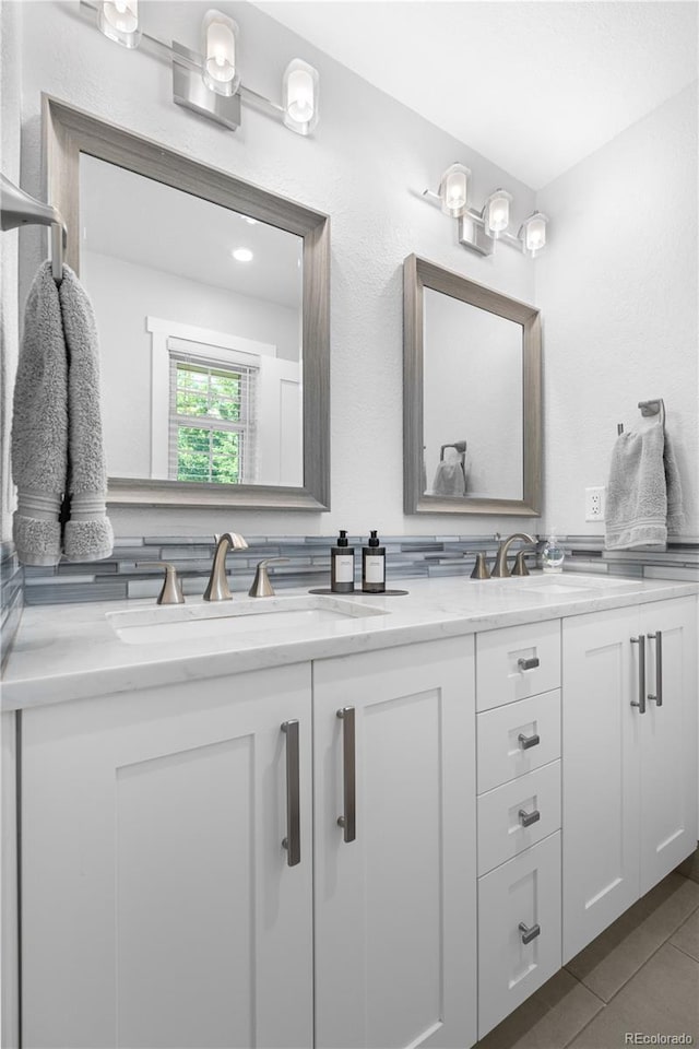 6795 E Kettle Ave, Centennial, CO 80112 - bathroom with double vanity and tile patterned flooring