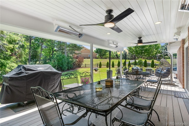 6795 E Kettle Ave, Centennial, CO 80112 - wooden terrace with outdoor dining space, area for grilling, ceiling fan, and a yard