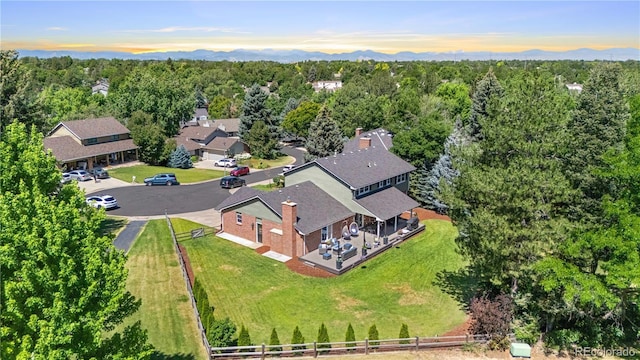 6795 E Kettle Ave, Centennial, CO 80112 - aerial view of property and surrounding area with a forest and a mountain backdrop