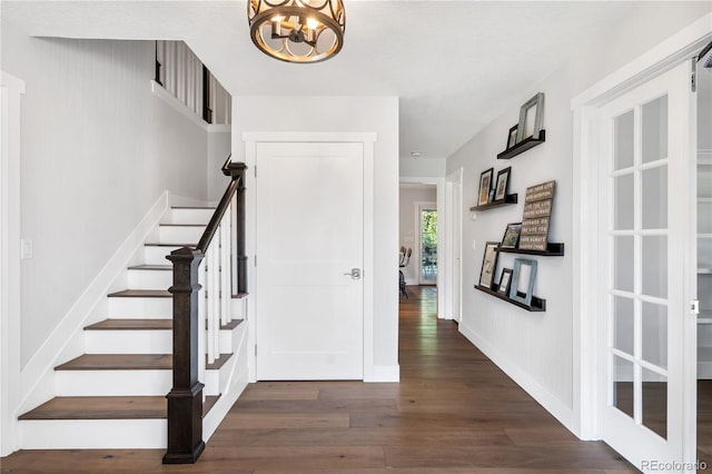 6795 E Kettle Ave, Centennial, CO 80112 - stairs featuring wood finished floors and a chandelier