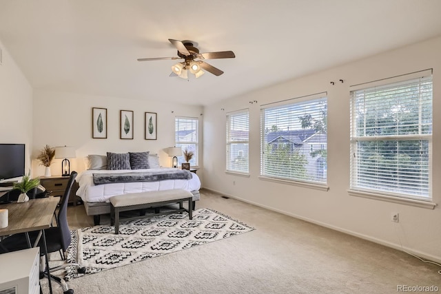 bedroom featuring light colored carpet and ceiling fan