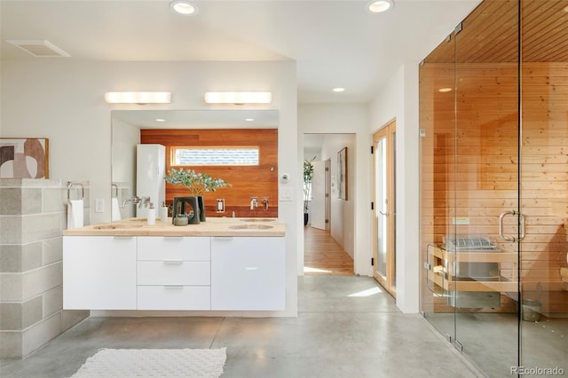 full bath with recessed lighting, a stall shower, and finished concrete flooring