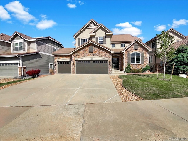 2180 Trailblazer Way, Castle Rock, CO 80109 - craftsman inspired home with stone siding, driveway, a front lawn, a garage, and stucco siding
