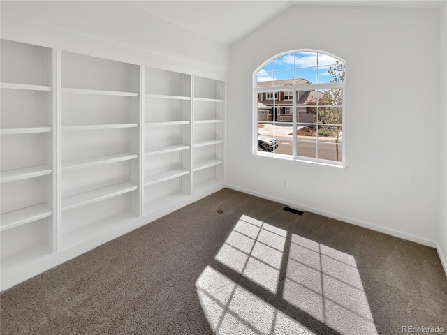 2180 Trailblazer Way, Castle Rock, CO 80109 - unfurnished room featuring dark colored carpet, lofted ceiling, and baseboards