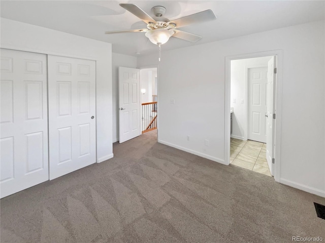 2180 Trailblazer Way, Castle Rock, CO 80109 - unfurnished bedroom featuring carpet floors, baseboards, a closet, and a ceiling fan