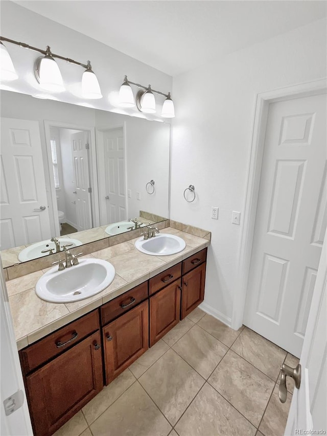 2180 Trailblazer Way, Castle Rock, CO 80109 - full bathroom with toilet, tile patterned flooring, and double vanity