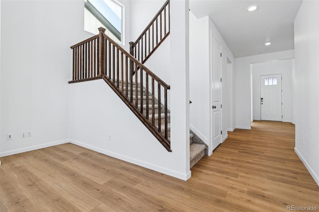 stairway featuring hardwood / wood-style flooring