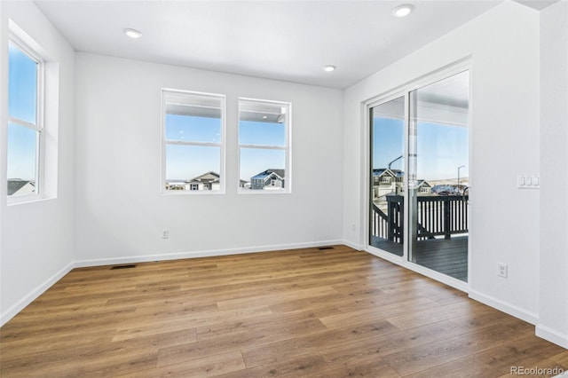 spare room featuring hardwood / wood-style floors