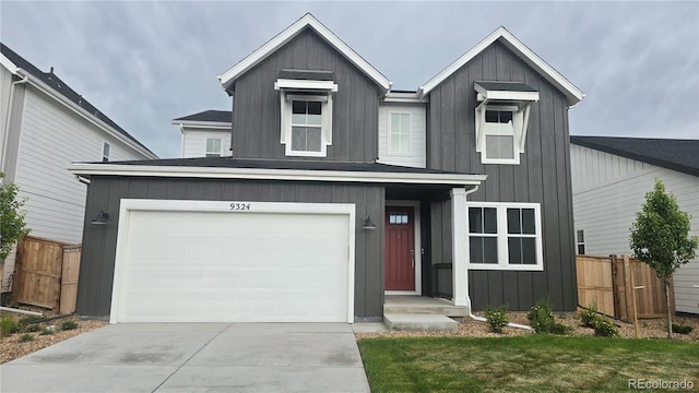9324 Quartz St, Arvada, CO 80007 - view of front of home with board and batten siding and driveway