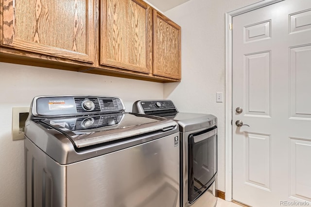 16341 Maple Rock Ct, Parker, CO 80134 - washroom featuring washing machine and clothes dryer and cabinet space