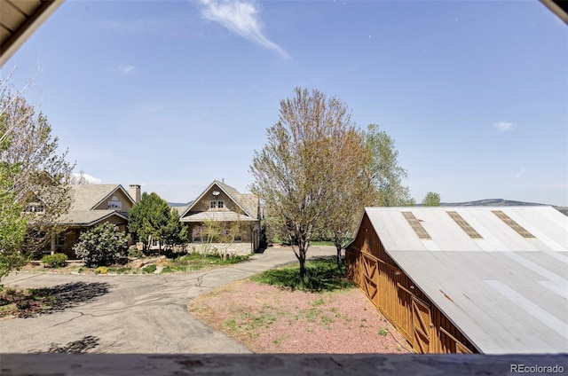 view of home's exterior with a barn