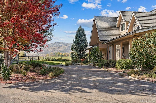 view of asphalt driveway with a mountain view