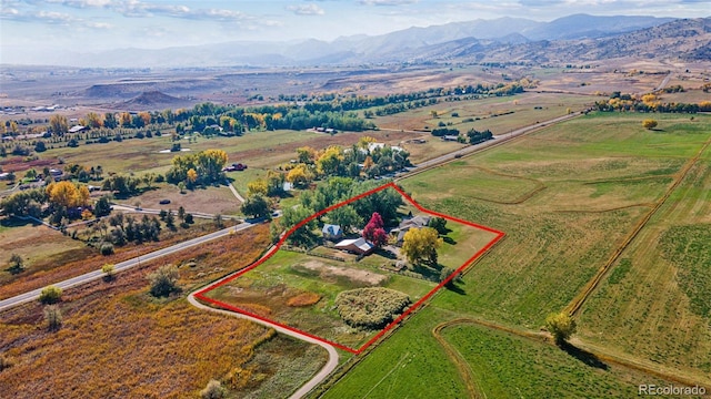 view of rural area with property boundaries highlighted and mountains