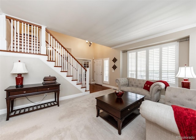 1530 Woodrose Ct, Colorado Springs, CO 80921 - carpeted living room with stairs, ornamental molding, and baseboards