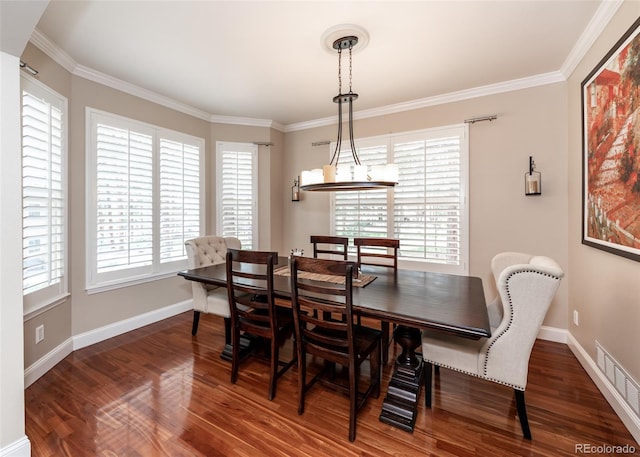 1530 Woodrose Ct, Colorado Springs, CO 80921 - dining space with wood finished floors, crown molding, and baseboards