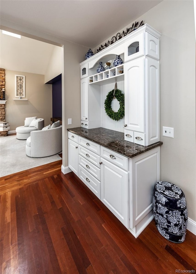 1530 Woodrose Ct, Colorado Springs, CO 80921 - mudroom with dark wood-style floors and baseboards