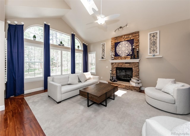 1530 Woodrose Ct, Colorado Springs, CO 80921 - living area featuring a ceiling fan, healthy amount of natural light, baseboards, and lofted ceiling