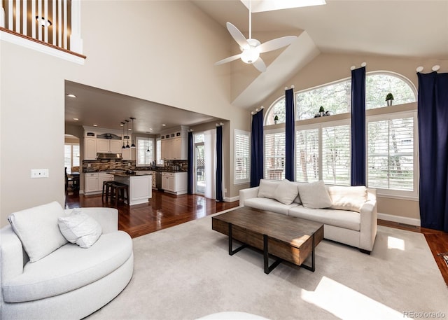 1530 Woodrose Ct, Colorado Springs, CO 80921 - living room with a ceiling fan, wood finished floors, high vaulted ceiling, baseboards, and recessed lighting