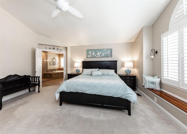 1530 Woodrose Ct, Colorado Springs, CO 80921 - bedroom featuring carpet flooring, multiple windows, ensuite bath, lofted ceiling, and a ceiling fan