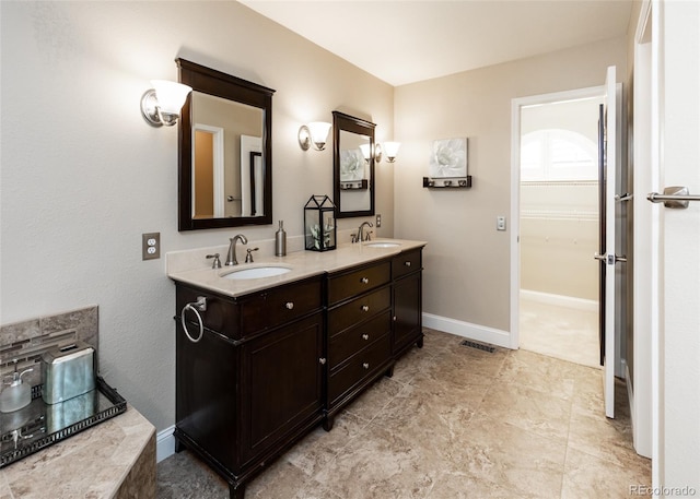 1530 Woodrose Ct, Colorado Springs, CO 80921 - bathroom with double vanity and baseboards