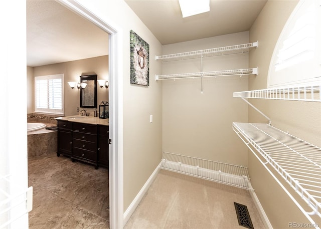 1530 Woodrose Ct, Colorado Springs, CO 80921 - walk in closet featuring a sink