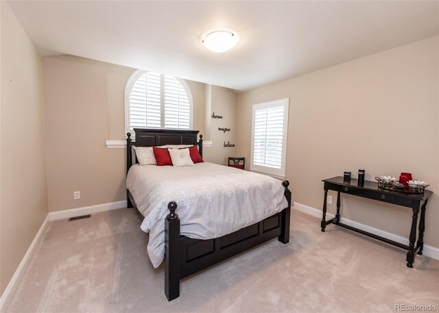 1530 Woodrose Ct, Colorado Springs, CO 80921 - bedroom with light colored carpet and baseboards