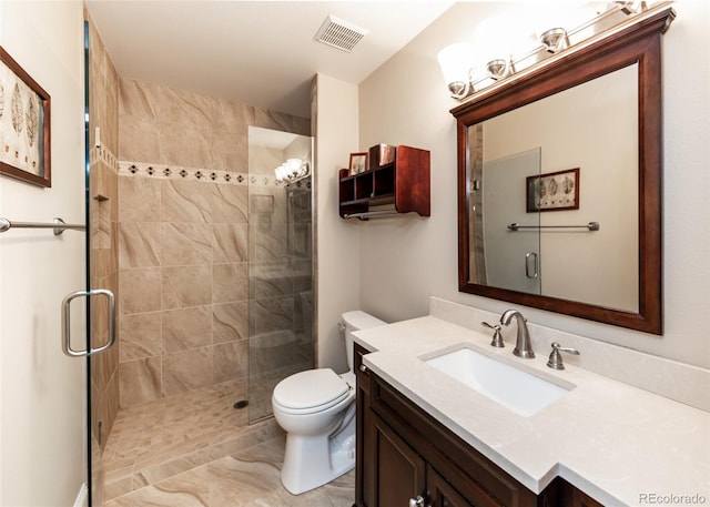 1530 Woodrose Ct, Colorado Springs, CO 80921 - full bathroom with vanity, a shower stall, toilet, and marble look tile flooring