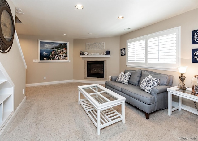 1530 Woodrose Ct, Colorado Springs, CO 80921 - living room with a glass covered fireplace, recessed lighting, carpet flooring, and baseboards