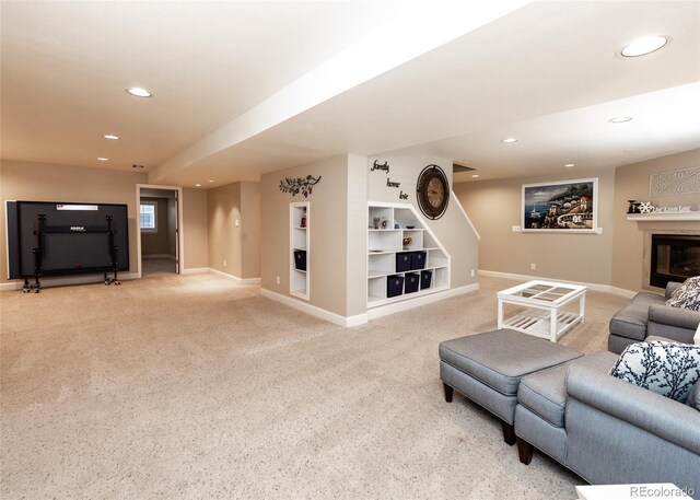 1530 Woodrose Ct, Colorado Springs, CO 80921 - living area featuring recessed lighting, light colored carpet, baseboards, built in features, and a glass covered fireplace