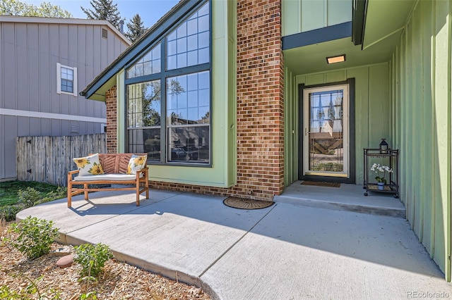 8820 W 80th Dr, Arvada, CO 80005 - property entrance featuring brick siding and board and batten siding