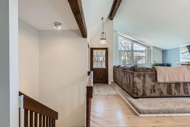 8820 W 80th Dr, Arvada, CO 80005 - entrance foyer featuring wood finished floors and a textured ceiling