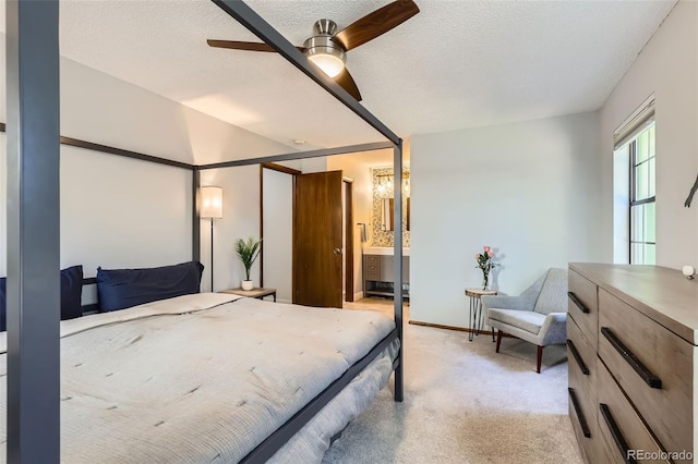 8820 W 80th Dr, Arvada, CO 80005 - bedroom featuring light colored carpet, a textured ceiling, ceiling fan, and ensuite bathroom