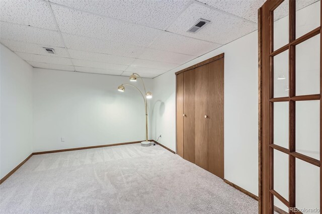 8820 W 80th Dr, Arvada, CO 80005 - unfurnished bedroom with carpet flooring, a paneled ceiling, baseboards, and a closet