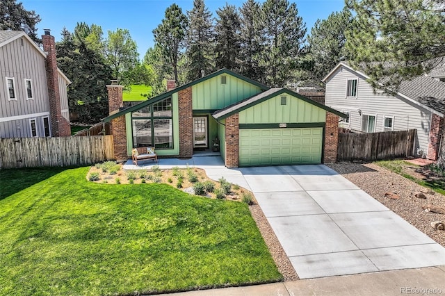 8820 W 80th Dr, Arvada, CO 80005 - view of front of property with board and batten siding, a garage, concrete driveway, brick siding, and a chimney
