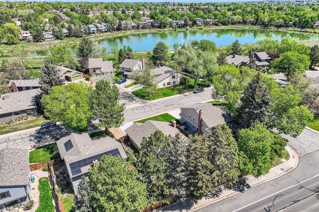8820 W 80th Dr, Arvada, CO 80005 - aerial perspective of suburban area featuring a large body of water and a tree filled landscape