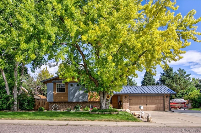 view of front facade with a front yard and a garage