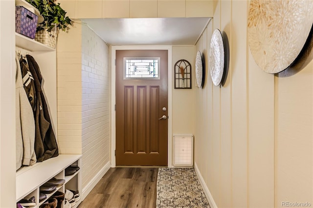 mudroom with wood-type flooring