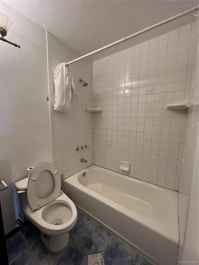 16032 E Floyd Ave, Aurora, CO 80013 - bathroom featuring tile patterned floors, shower / bath combination, and a textured ceiling