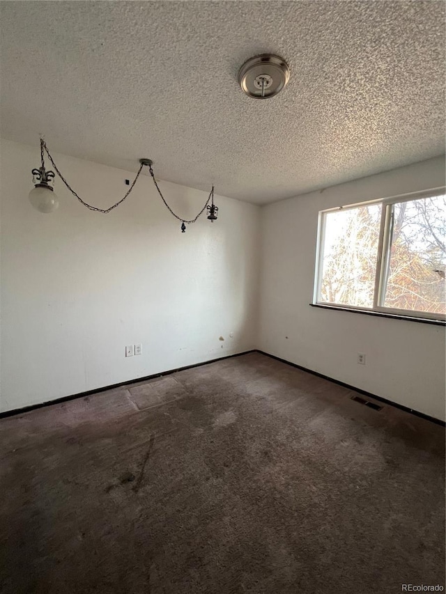16032 E Floyd Ave, Aurora, CO 80013 - carpeted empty room with a textured ceiling