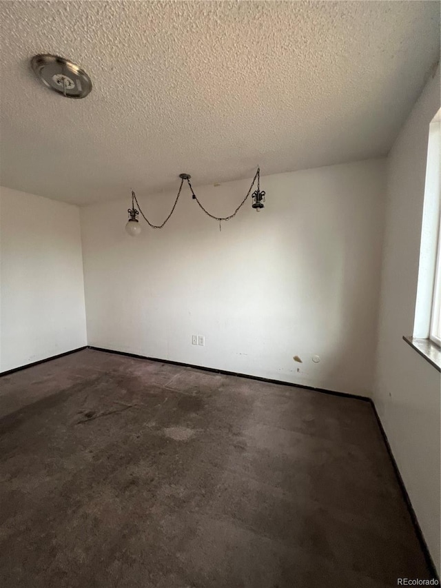 16032 E Floyd Ave, Aurora, CO 80013 - spare room featuring a textured ceiling