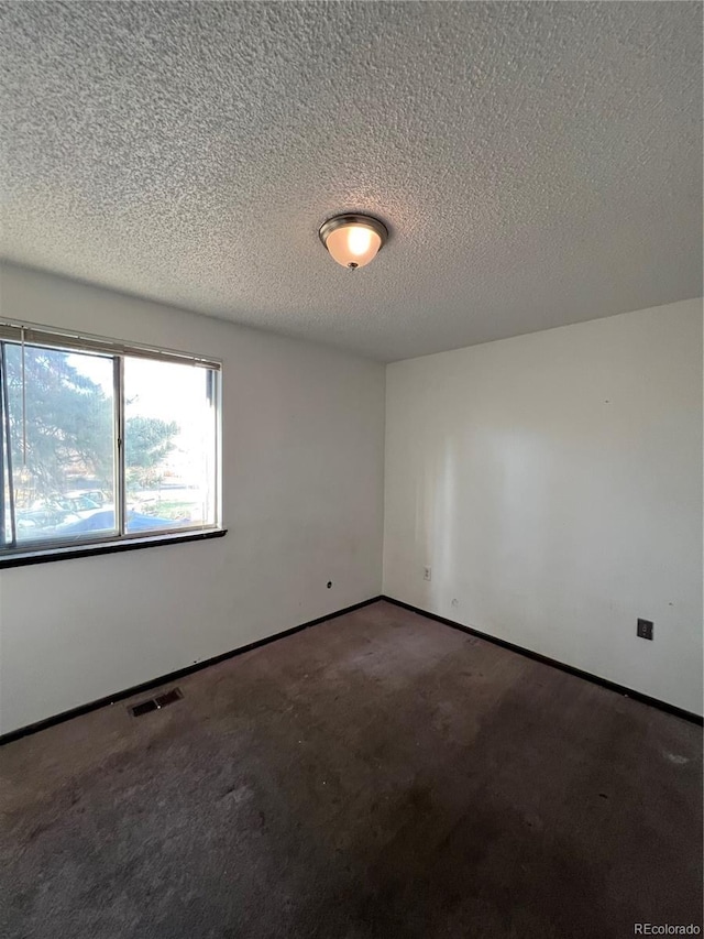 16032 E Floyd Ave, Aurora, CO 80013 - carpeted spare room with a textured ceiling