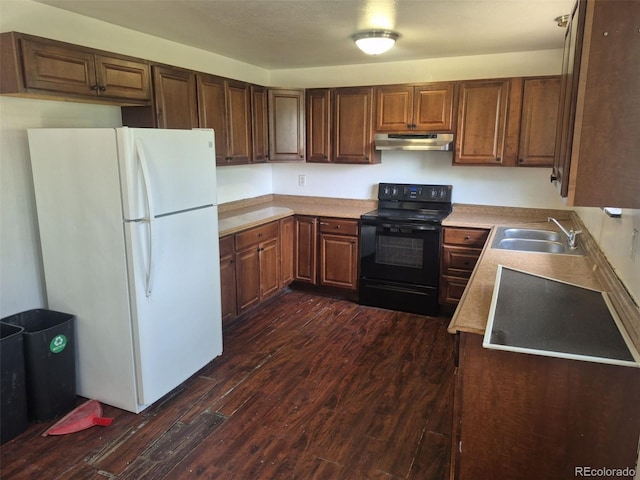 16032 E Floyd Ave, Aurora, CO 80013 - kitchen with freestanding refrigerator, black range with electric stovetop, under cabinet range hood, a sink, and dark wood-type flooring