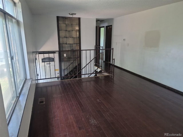 16032 E Floyd Ave, Aurora, CO 80013 - unfurnished room with wood finished floors and baseboards