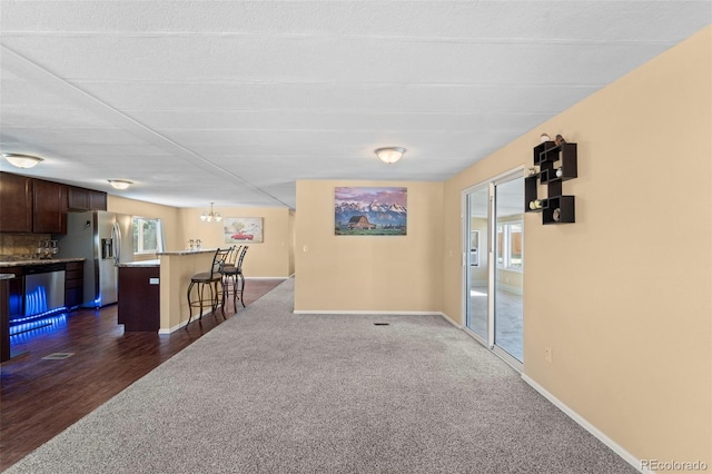 interior space with a chandelier and dark hardwood / wood-style floors