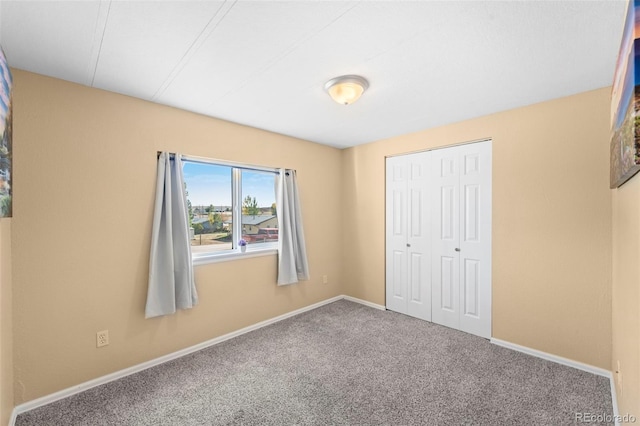 unfurnished bedroom featuring a closet and carpet