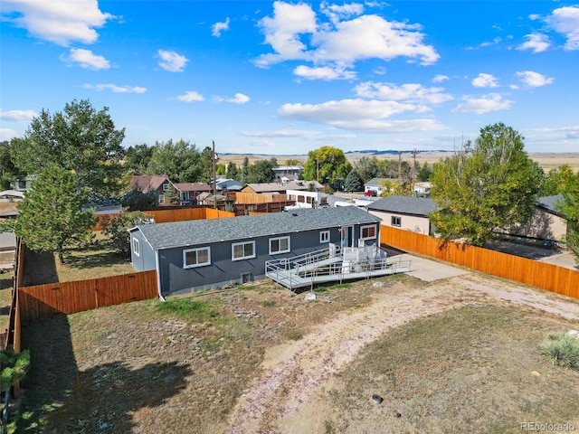 back of house featuring a patio area and a wooden deck