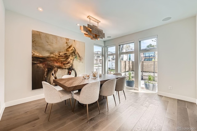 427 Milwaukee St, Denver, CO 80206 - dining space with baseboards, recessed lighting, and wood finished floors
