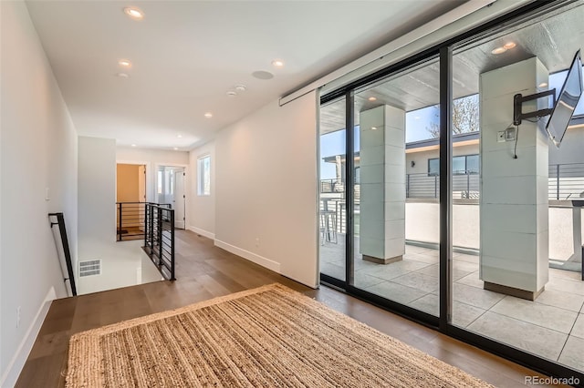 427 Milwaukee St, Denver, CO 80206 - entryway featuring visible vents, recessed lighting, baseboards, and wood finished floors